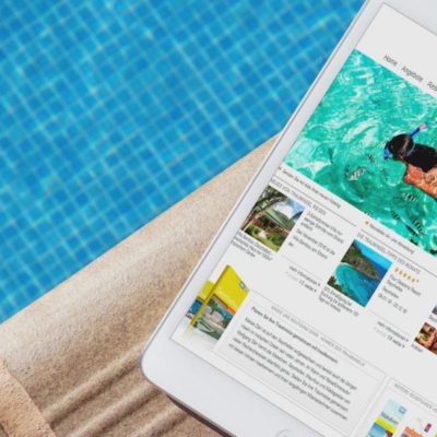 Ipad am pool mit www.trauminselreisen.de auf dem Bild